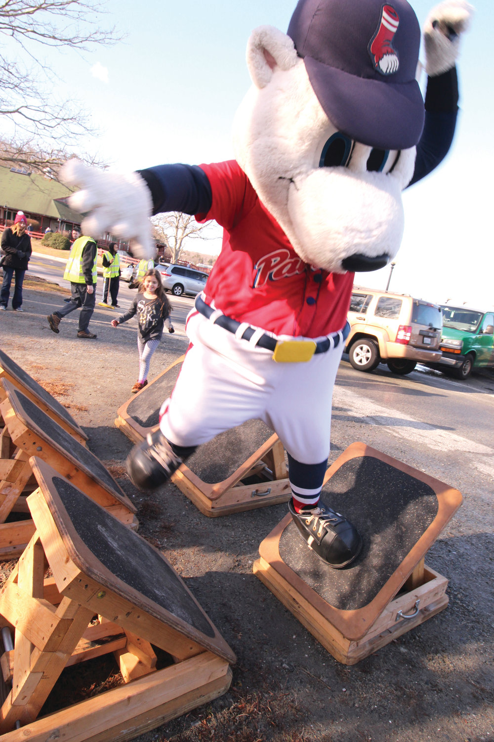 KEEPING HIS BALANCE: The PawSox mascot takes to the kiddie obsta course.